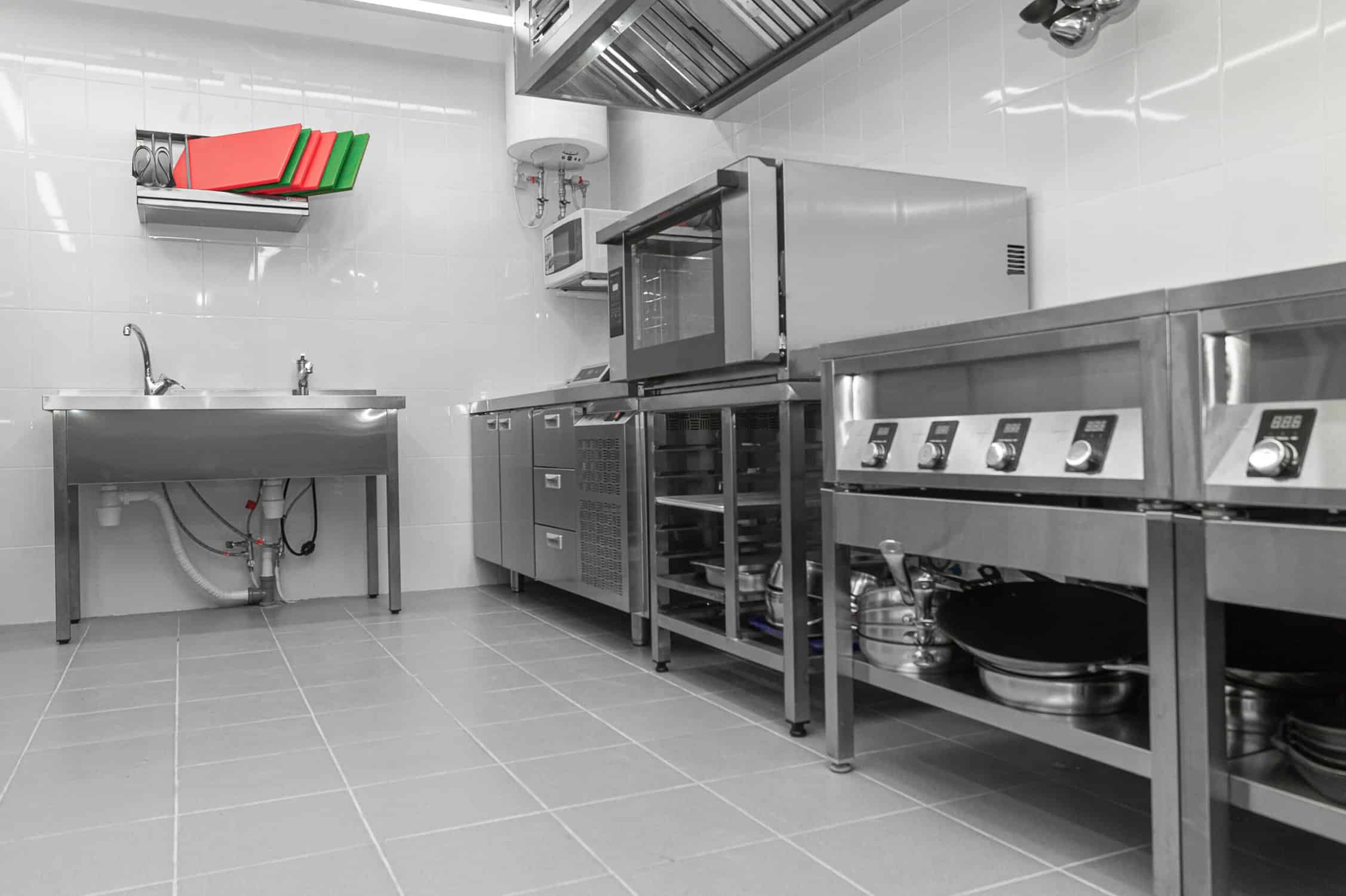 commercial kitchen with stainless steel equipment, hot shop, food industry.