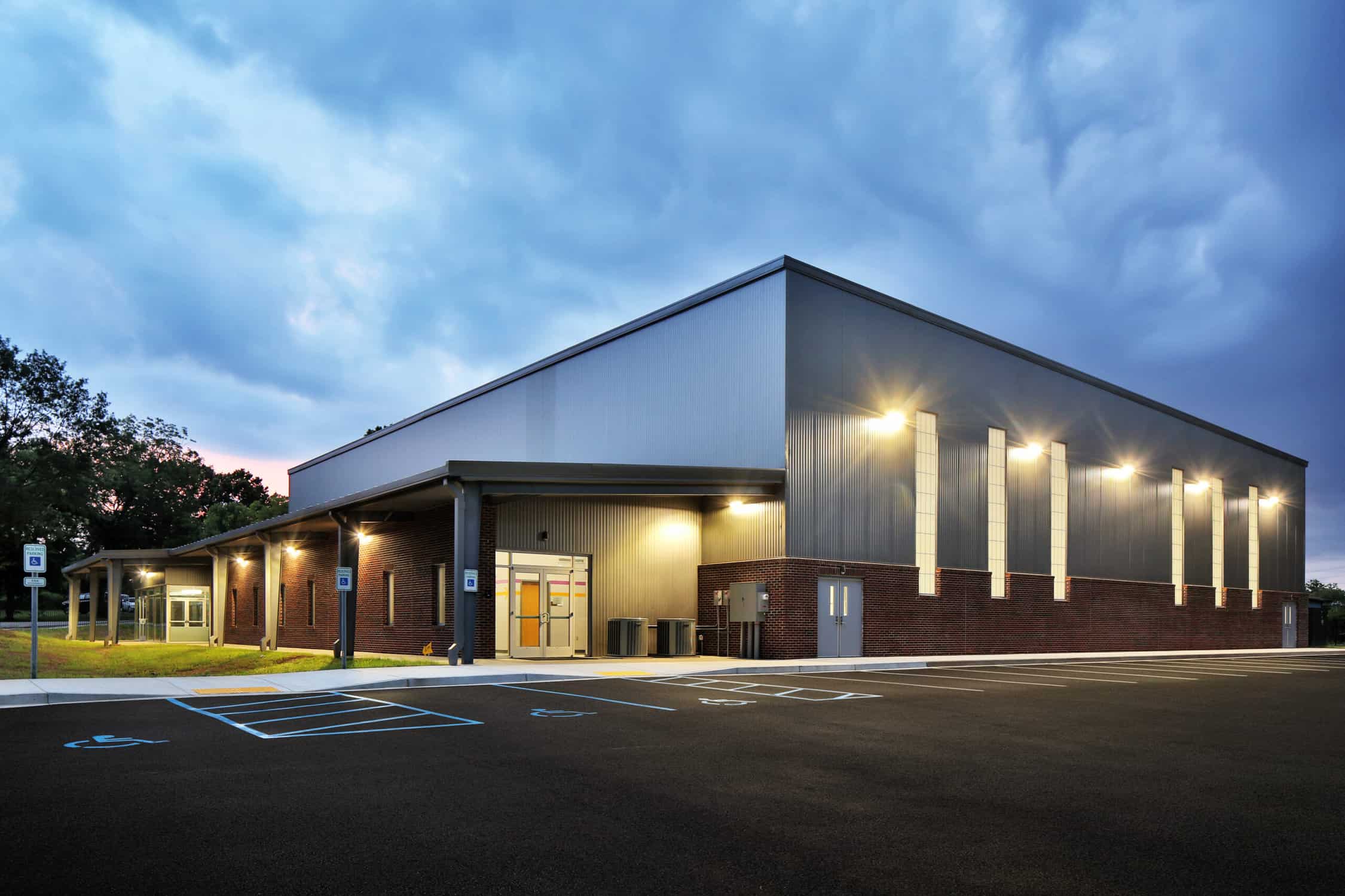 Exterior warehouse gym building at night